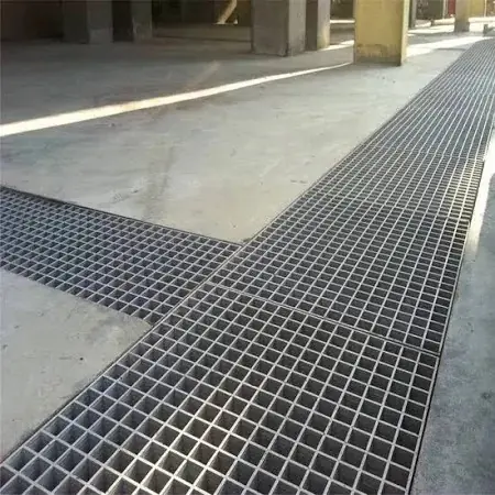Grating covering a floor drainage trench